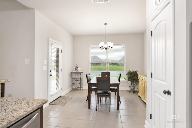 21105 Zinfandel Ln, Silverhill, AL 36576 - dining area with visible vents, baseboards, an inviting chandelier, and light tile patterned flooring