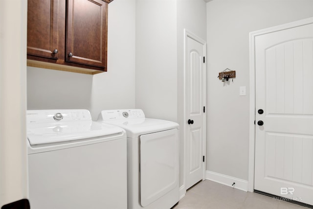 21105 Zinfandel Ln, Silverhill, AL 36576 - laundry area featuring washing machine and dryer, baseboards, and cabinet space
