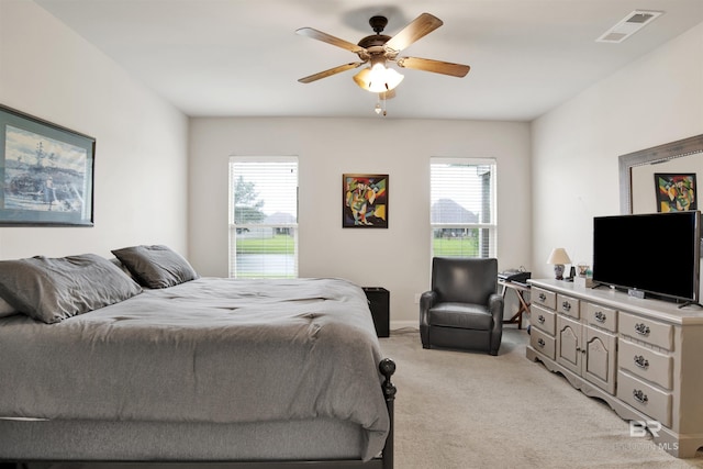 21105 Zinfandel Ln, Silverhill, AL 36576 - bedroom with a ceiling fan, light colored carpet, multiple windows, and visible vents