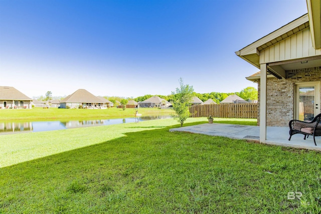 21105 Zinfandel Ln, Silverhill, AL 36576 - view of yard featuring a water view, fence, and a patio