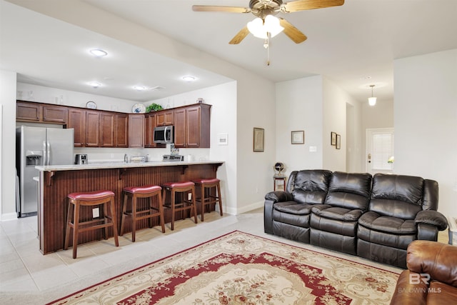 21105 Zinfandel Ln, Silverhill, AL 36576 - living area with light tile patterned floors, baseboards, and a ceiling fan