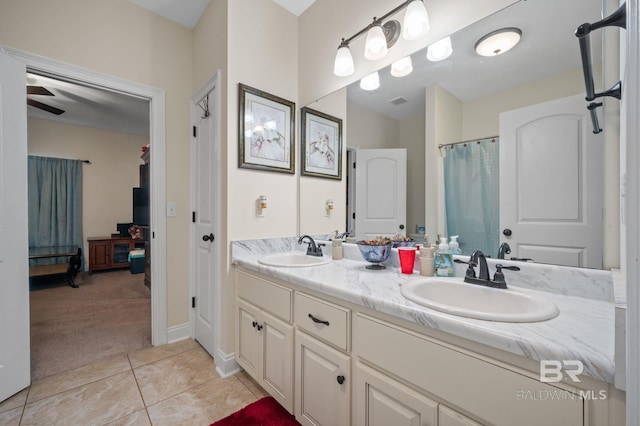 bathroom with ceiling fan, tile patterned floors, and vanity