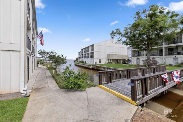 view of dock featuring a deck with water view