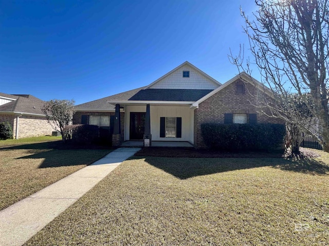 10340 Gayfer Road Ext, Fairhope, AL 36532 - view of front of property featuring covered porch, a front yard, and roof with shingles