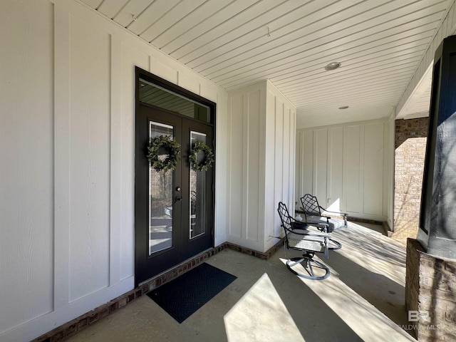 entrance to property featuring board and batten siding and french doors