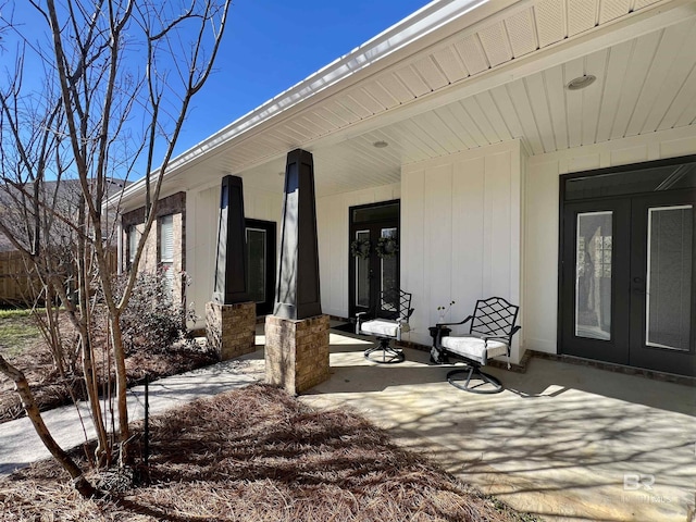 view of patio with french doors and a porch