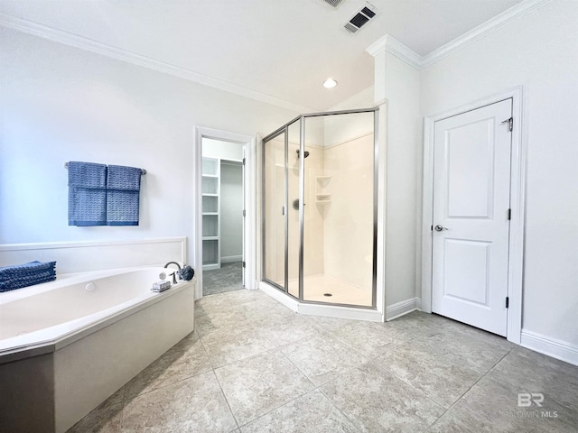 10340 Gayfer Road Ext, Fairhope, AL 36532 - full bathroom with visible vents, a shower stall, ornamental molding, a garden tub, and a walk in closet