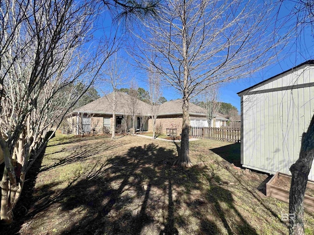 view of yard featuring fence