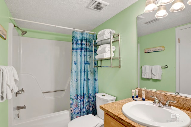 full bathroom with shower / bath combo with shower curtain, toilet, a textured ceiling, and vanity