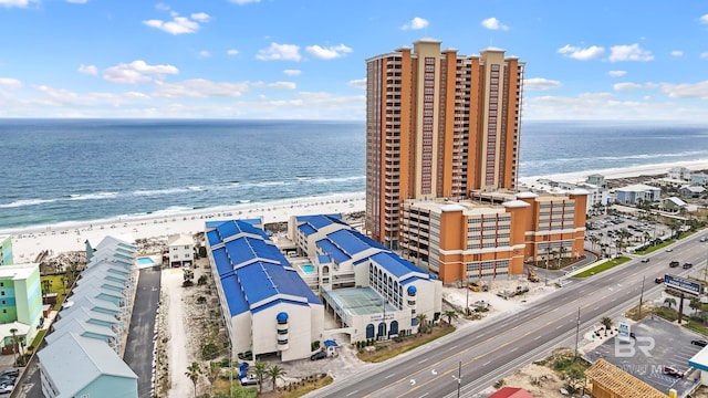 drone / aerial view with a water view and a view of the beach