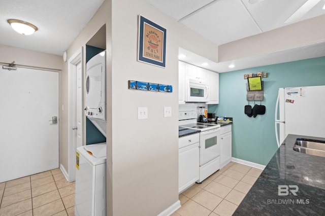 kitchen featuring white cabinetry, white appliances, and light tile patterned flooring