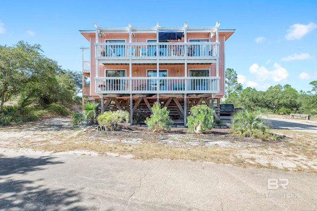 back of property with a balcony