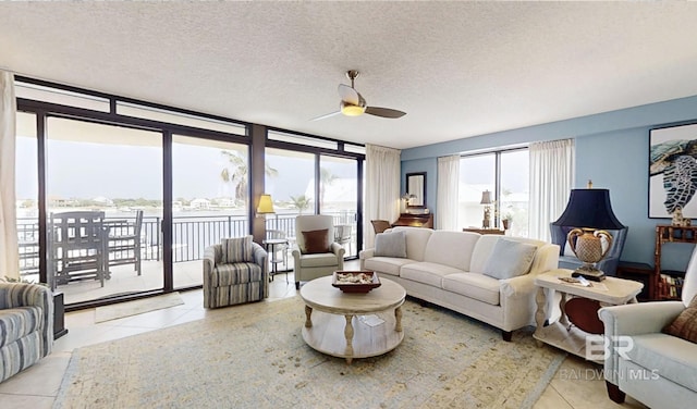 29235 Perdido Beach Blvd Unit 203, Orange Beach, AL 36561 - living area with ceiling fan, tile patterned floors, and a textured ceiling