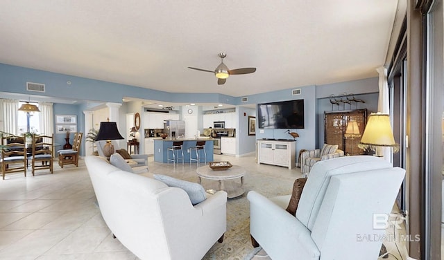 29235 Perdido Beach Blvd Unit 203, Orange Beach, AL 36561 - living room with ceiling fan and light tile patterned floors
