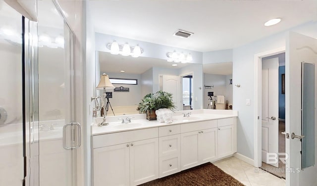 29235 Perdido Beach Blvd Unit 203, Orange Beach, AL 36561 - full bathroom featuring double vanity, a stall shower, and tile patterned floors