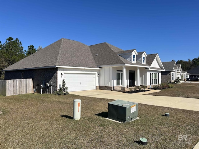 view of front facade with a front yard and a garage