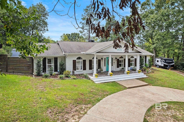 view of front of home with a front lawn and a porch