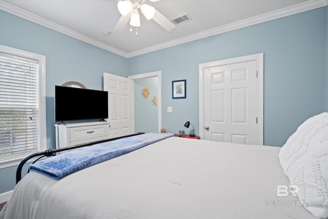 bedroom featuring ceiling fan and ornamental molding