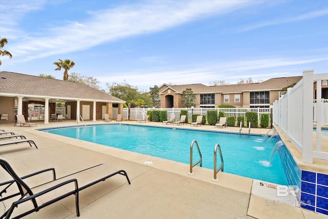 view of swimming pool featuring a patio area and pool water feature