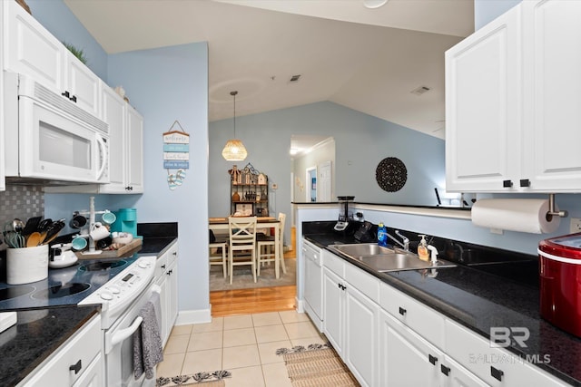 kitchen with sink, light hardwood / wood-style floors, decorative light fixtures, white appliances, and white cabinets