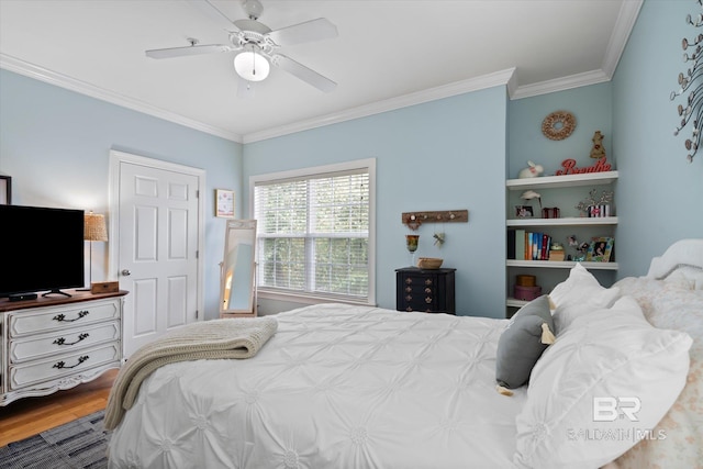 bedroom with ceiling fan, wood-type flooring, and crown molding