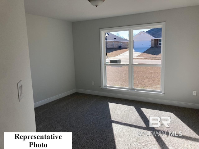 carpeted empty room with a healthy amount of sunlight