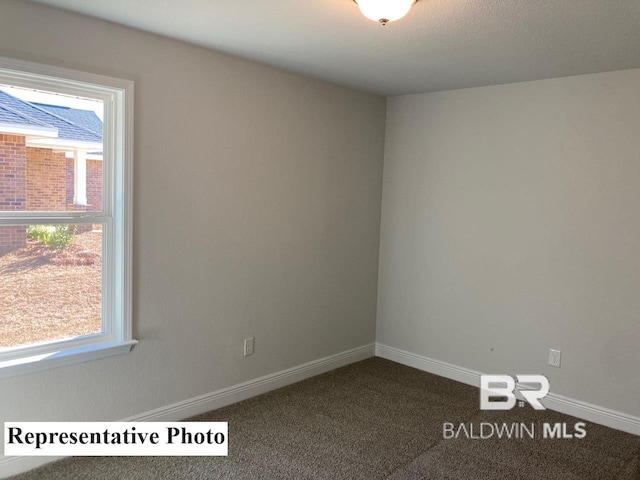 view of carpeted spare room