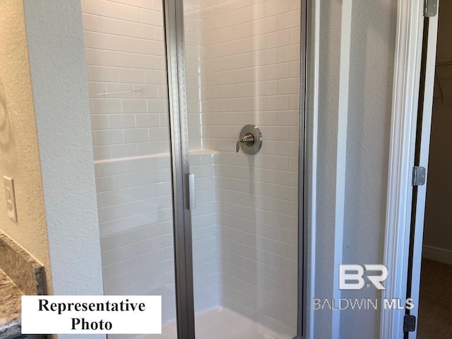 bathroom featuring an enclosed shower