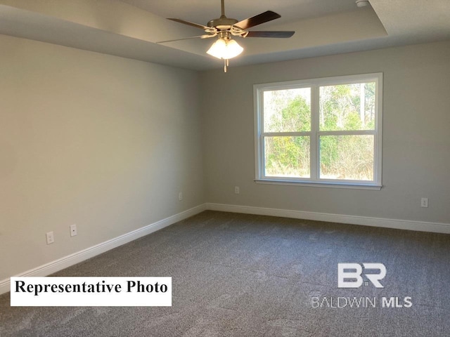 empty room with carpet floors and ceiling fan