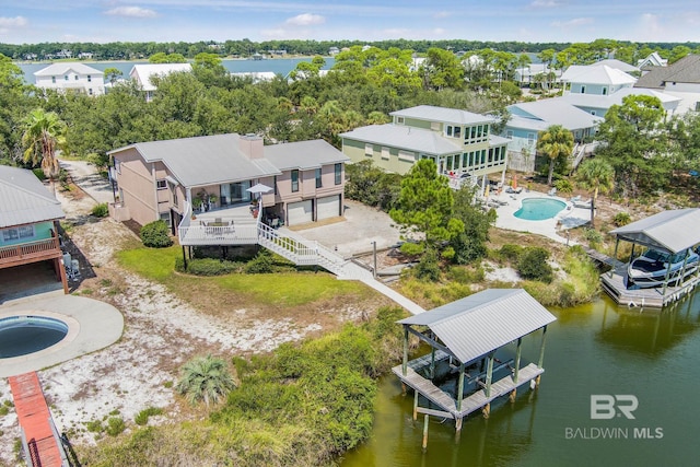 birds eye view of property featuring a water view