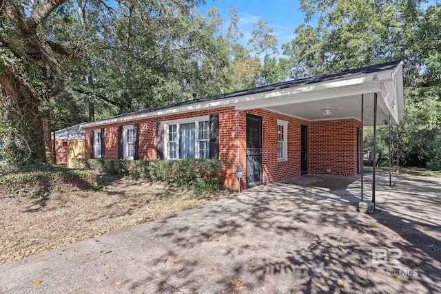 ranch-style home with a carport