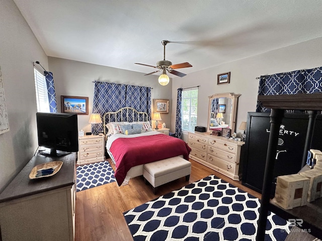 bedroom featuring hardwood / wood-style floors and ceiling fan