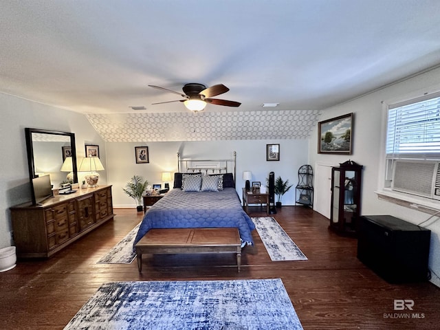 bedroom with ceiling fan, dark hardwood / wood-style flooring, and vaulted ceiling