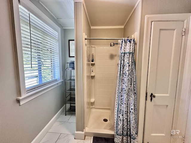 bathroom featuring walk in shower and ornamental molding