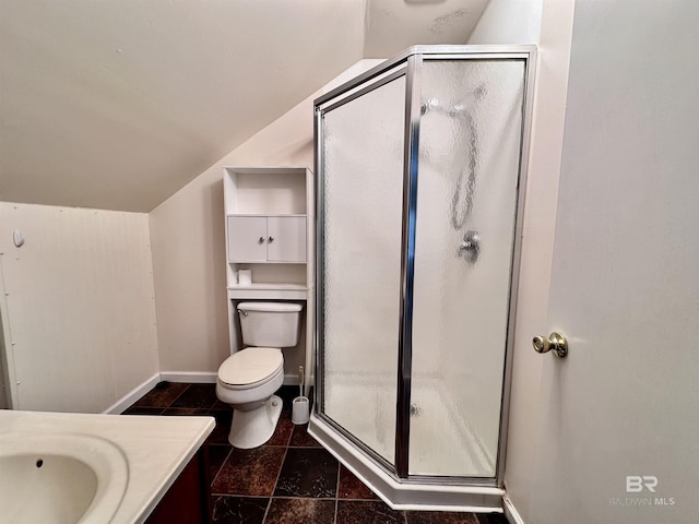 bathroom with vanity, toilet, walk in shower, and lofted ceiling