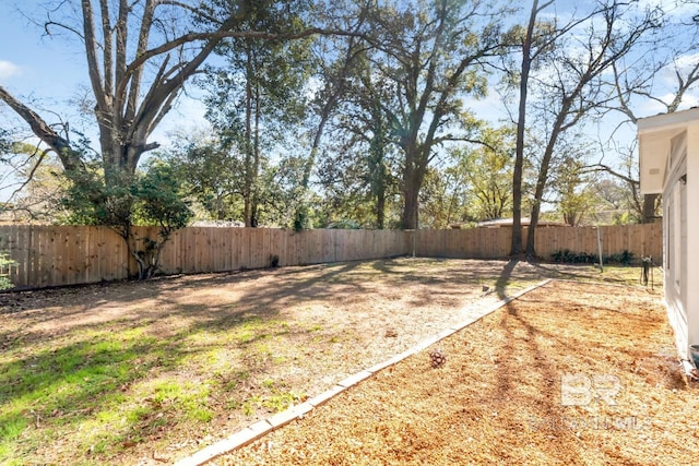 view of yard with a fenced backyard