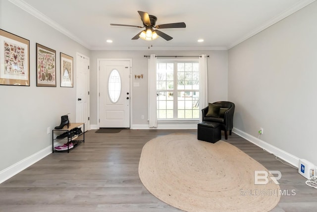 entryway with baseboards, recessed lighting, wood finished floors, and crown molding