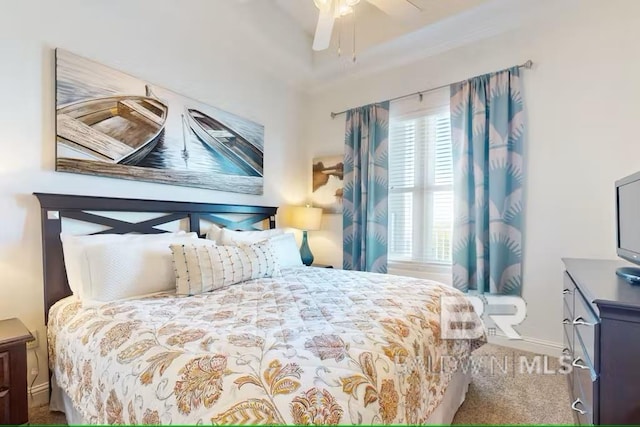 carpeted bedroom with baseboards and a ceiling fan