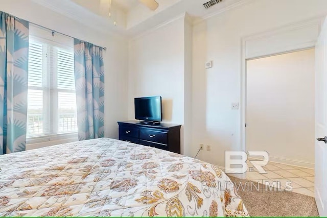 bedroom featuring baseboards, ornamental molding, visible vents, and tile patterned floors