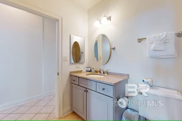 bathroom with tile patterned flooring and vanity