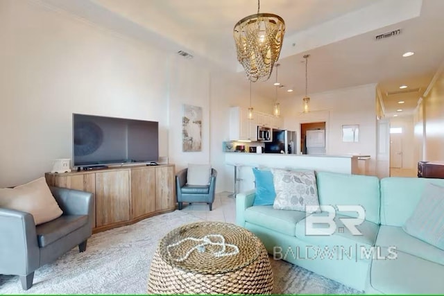 living room featuring visible vents, a chandelier, and recessed lighting