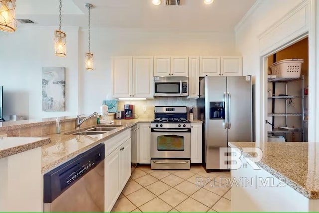 kitchen with crown molding, white cabinetry, stainless steel appliances, and a sink