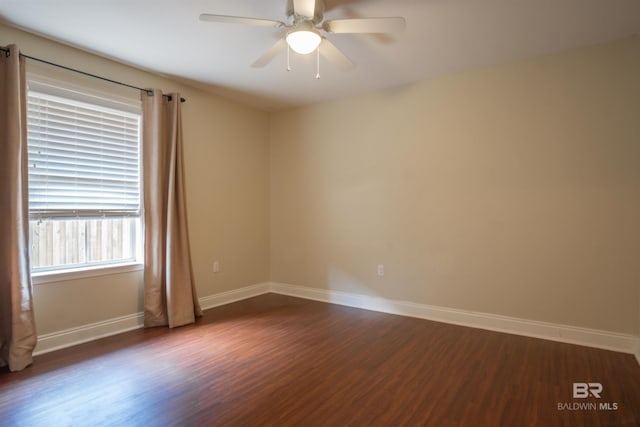 unfurnished room featuring ceiling fan and dark wood-type flooring