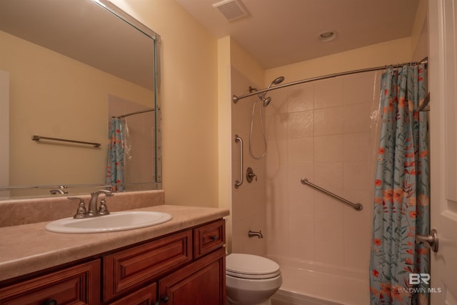 bathroom featuring a shower with shower curtain, toilet, and vanity