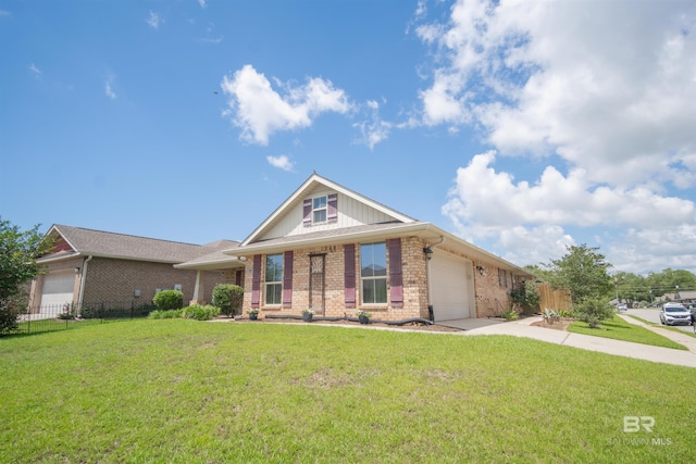 view of front of home with a garage and a front yard