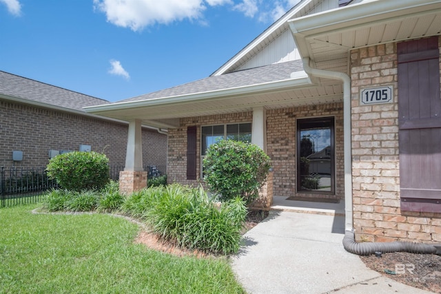 property entrance with a yard