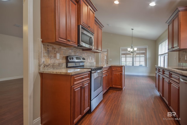 kitchen with stainless steel appliances, dark hardwood / wood-style flooring, and tasteful backsplash