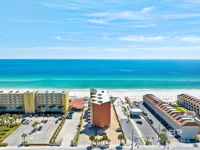 bird's eye view of expansive coastline and apartment complex