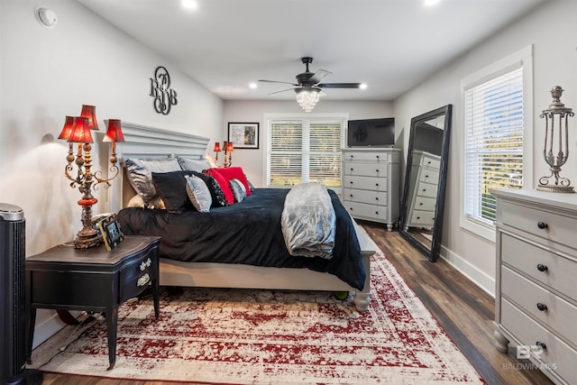 bedroom with ceiling fan and dark wood-type flooring