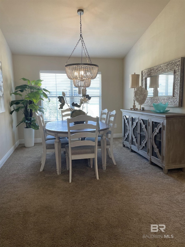 dining area featuring carpet flooring, vaulted ceiling, and baseboards